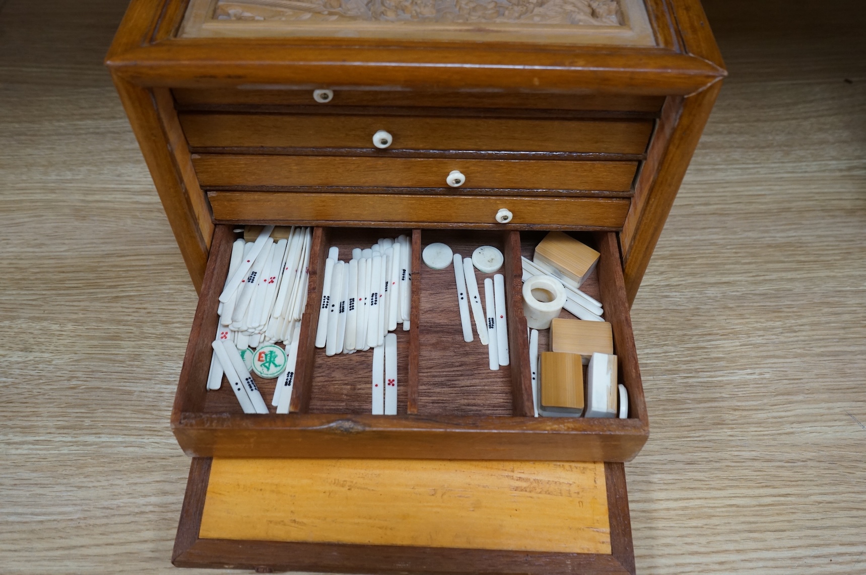 A Chinese carved boxed mahjong set and stands, box 24 cm high including handle